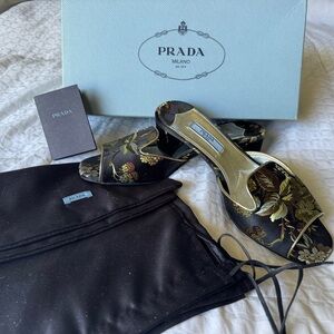 Prada Women's Black and Gold Floral Mules